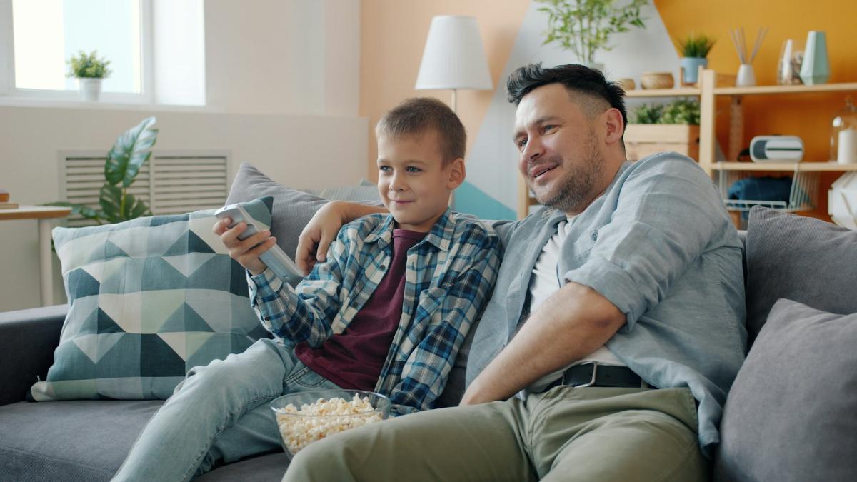 Father and son watching TV